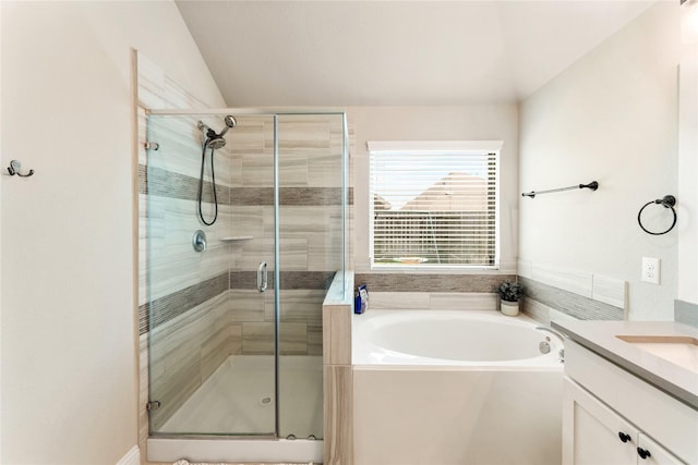 21718 Rose Maris Ln, Tomball, TX 77377 - bathroom with vanity, a garden tub, a stall shower, and lofted ceiling