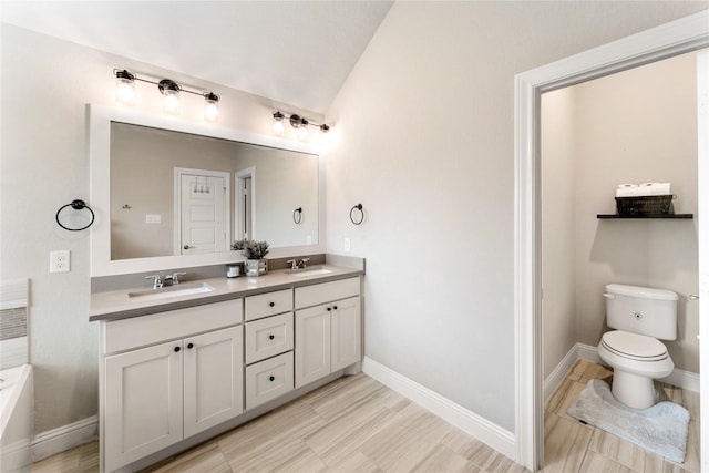 21718 Rose Maris Ln, Tomball, TX 77377 - full bathroom featuring baseboards, a sink, and lofted ceiling