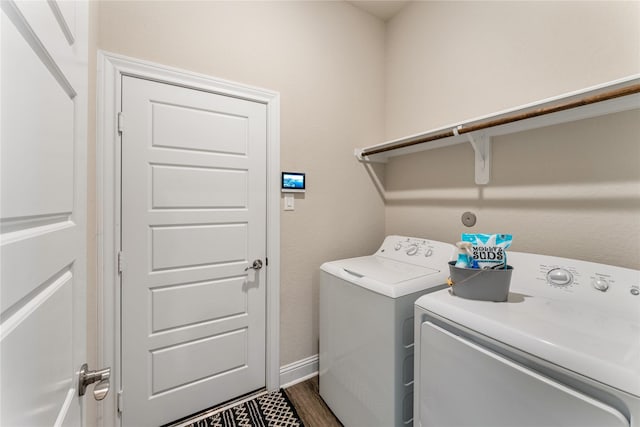 21718 Rose Maris Ln, Tomball, TX 77377 - laundry area with independent washer and dryer, dark wood-type flooring, laundry area, and baseboards