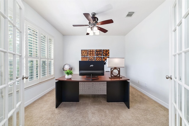 carpeted office space with baseboards, a ceiling fan, french doors, and visible vents