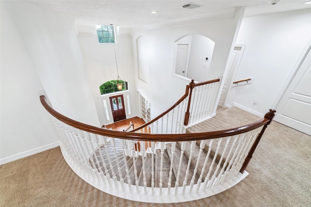 stairs with carpet floors, recessed lighting, baseboards, and visible vents