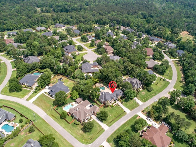 aerial view with a residential view and a wooded view