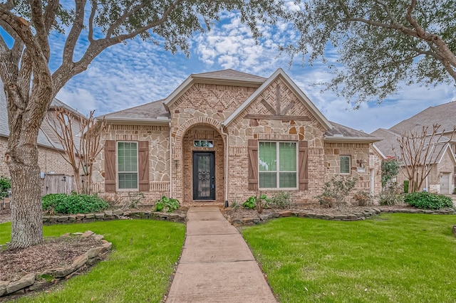 3215 Wimberly Place Ln, Katy, TX 77494 - view of front of property featuring a front yard, stone siding, a shingled roof, and brick siding