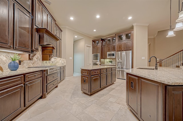 3215 Wimberly Place Ln, Katy, TX 77494 - kitchen featuring appliances with stainless steel finishes, an island with sink, a sink, ornamental molding, and decorative backsplash