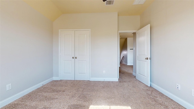 2135 Llerena Ln, League City, TX 77573 - unfurnished bedroom featuring carpet, a closet, vaulted ceiling, and baseboards