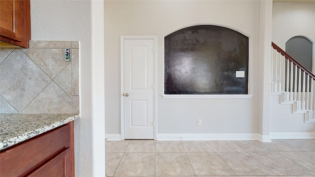 2135 Llerena Ln, League City, TX 77573 - entrance foyer featuring light tile patterned floors, stairs, and baseboards
