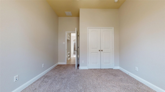 2135 Llerena Ln, League City, TX 77573 - unfurnished bedroom with a closet, carpet floors, and baseboards