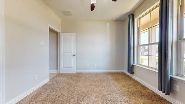 2135 Llerena Ln, League City, TX 77573 - empty room with carpet floors, ceiling fan, and baseboards