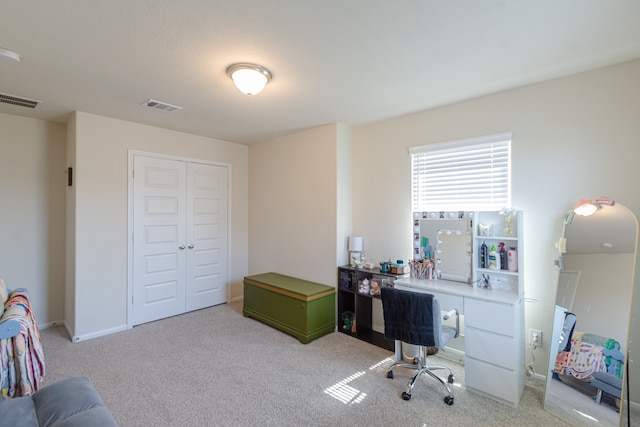 office area with light colored carpet and visible vents