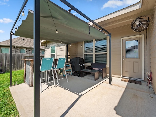 view of patio / terrace with area for grilling, fence, and outdoor dry bar