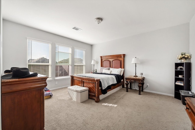 4430 Painted Bunting Ln, Baytown, TX 77521 - bedroom featuring light colored carpet, baseboards, and visible vents