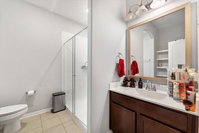 4430 Painted Bunting Ln, Baytown, TX 77521 - full bath featuring vanity, toilet, a stall shower, baseboards, and tile patterned floors