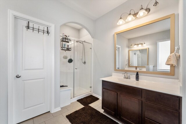 4430 Painted Bunting Ln, Baytown, TX 77521 - full bath with tile patterned floors, vanity, baseboards, and a stall shower