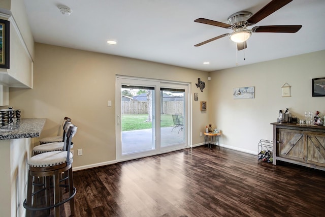 5522 Duxbury St, Houston, TX 77035 - living room featuring dark wood-style flooring, a ceiling fan, baseboards, and recessed lighting