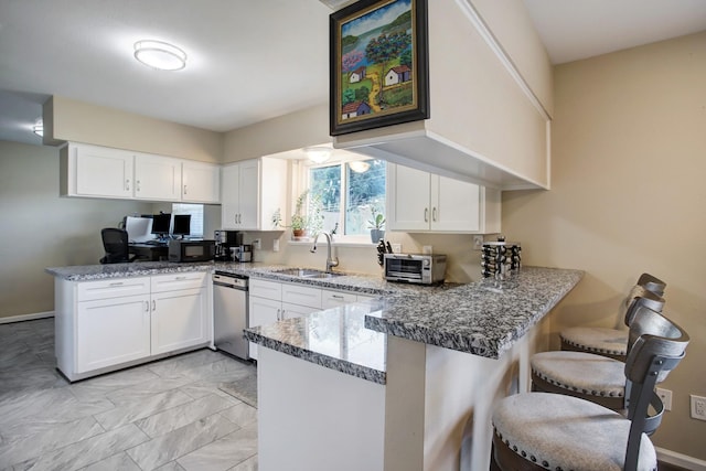 5522 Duxbury St, Houston, TX 77035 - kitchen featuring a peninsula, dishwasher, a sink, white cabinets, and light marble finish floors