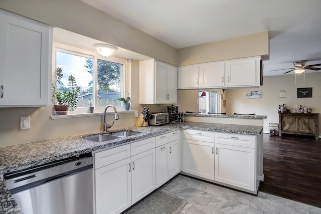 5522 Duxbury St, Houston, TX 77035 - kitchen featuring dishwasher, a sink, stone counters, ceiling fan, and white cabinetry