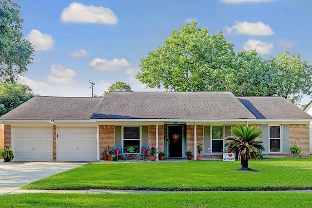 5522 Duxbury St, Houston, TX 77035 - view of front of property featuring a porch, an attached garage, brick siding, and concrete driveway