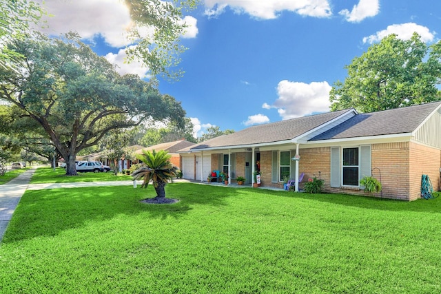5522 Duxbury St, Houston, TX 77035 - ranch-style home featuring an attached garage, a porch, a front yard, and brick siding