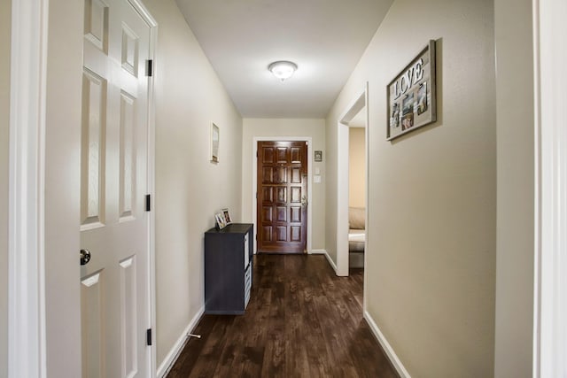 5522 Duxbury St, Houston, TX 77035 - corridor featuring dark wood finished floors and baseboards