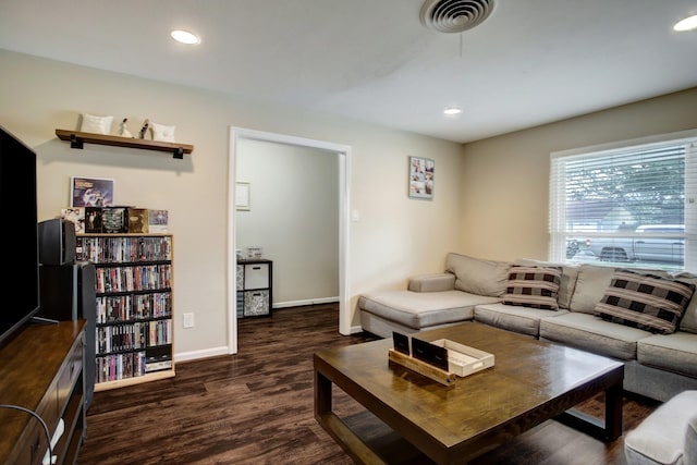 5522 Duxbury St, Houston, TX 77035 - living area featuring dark wood-style flooring, baseboards, and recessed lighting