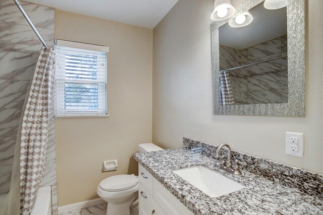 5522 Duxbury St, Houston, TX 77035 - bathroom with vanity, toilet, a tile shower, and marble look tile flooring