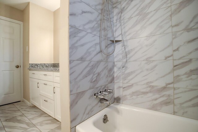 5522 Duxbury St, Houston, TX 77035 - full bathroom featuring vanity, marble look tile flooring, and tub / shower combination