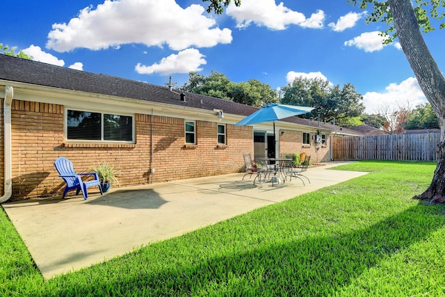 5522 Duxbury St, Houston, TX 77035 - back of house with brick siding, a patio area, and a shingled roof