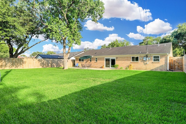 5522 Duxbury St, Houston, TX 77035 - back of property with a patio area and brick siding