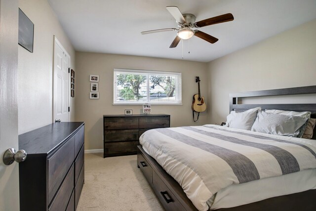 5522 Duxbury St, Houston, TX 77035 - bedroom with light carpet, baseboards, and a ceiling fan