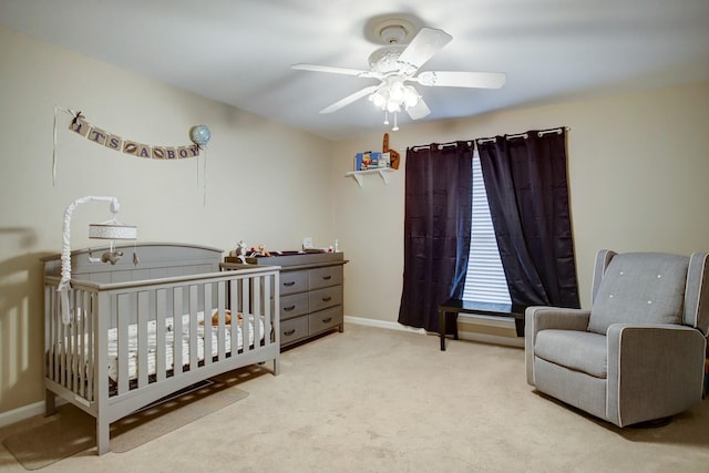 5522 Duxbury St, Houston, TX 77035 - carpeted bedroom with a crib, baseboards, and a ceiling fan