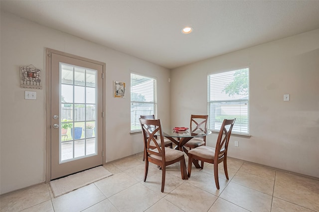 dining area featuring recessed lighting and light tile patterned flooring