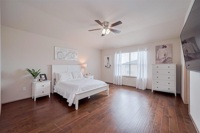 bedroom with ceiling fan and dark wood finished floors