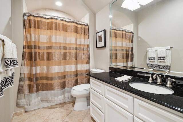 bathroom with tile patterned floors, curtained shower, vanity, and toilet