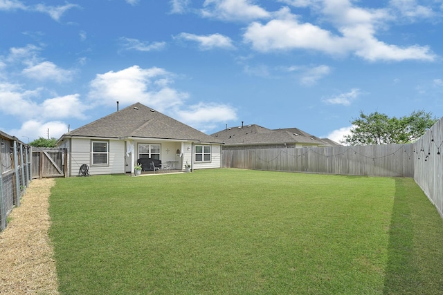 23231 Twilight Oaks Ct, Katy, TX 77493 - back of house featuring a patio area, roof with shingles, a fenced backyard, and a lawn