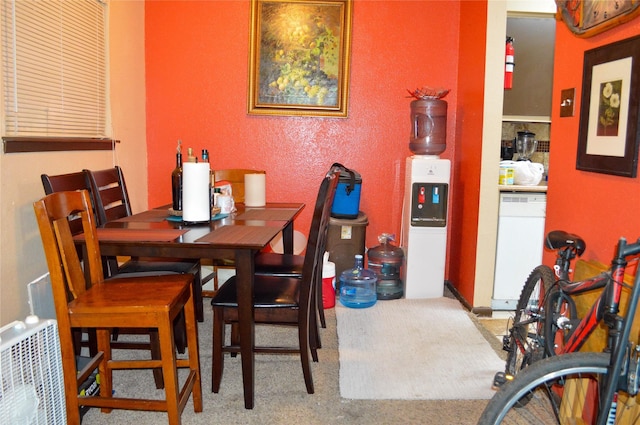 10203 Forum Park Dr Unit 114, Houston, TX 77036 - carpeted dining area featuring a textured wall