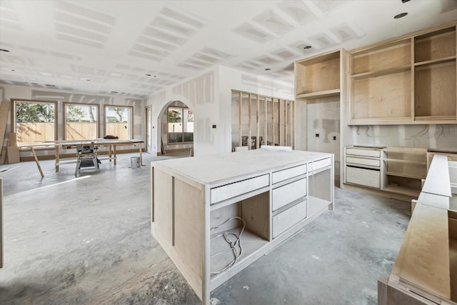 2006 Chantilly Ln, Houston, TX 77018 - kitchen with unfinished concrete floors, modern cabinets, open shelves, and a kitchen island