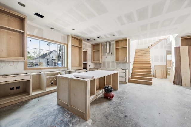 2006 Chantilly Ln, Houston, TX 77018 - kitchen featuring concrete flooring, open shelves, and a kitchen island