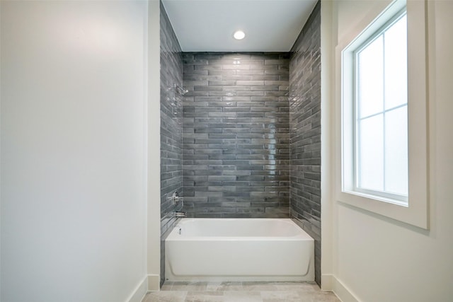 2006 Chantilly Ln, Houston, TX 77018 - bathroom featuring baseboards, tile patterned flooring, and shower / washtub combination
