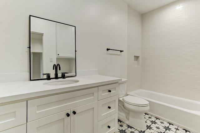 bathroom with toilet, vanity, and shower / washtub combination