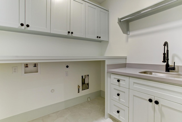 laundry area featuring a sink, gas dryer hookup, hookup for an electric dryer, cabinet space, and hookup for a washing machine