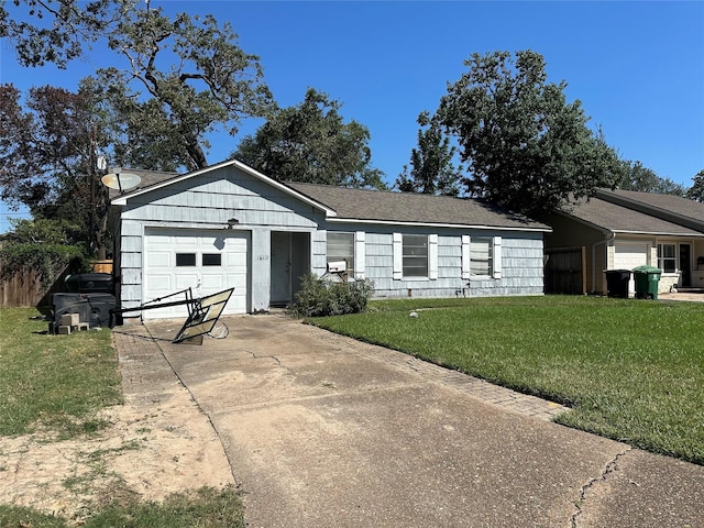 ranch-style home with a garage, a front yard, and driveway