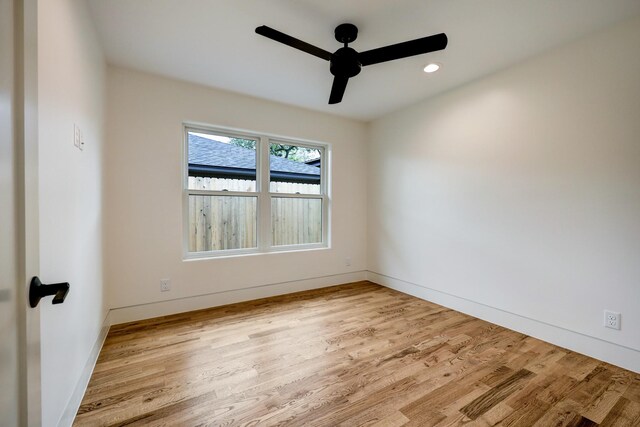 spare room with recessed lighting, baseboards, wood finished floors, and ceiling fan