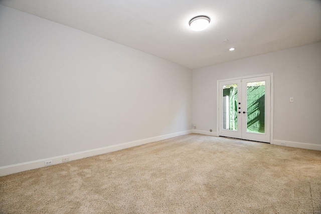 unfurnished room featuring french doors, carpet floors, baseboards, and recessed lighting