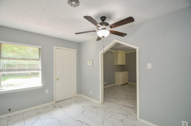 6606 Flamingo Dr, Houston, TX 77087 - empty room with marble finish floor, a textured ceiling, ceiling fan, and visible vents