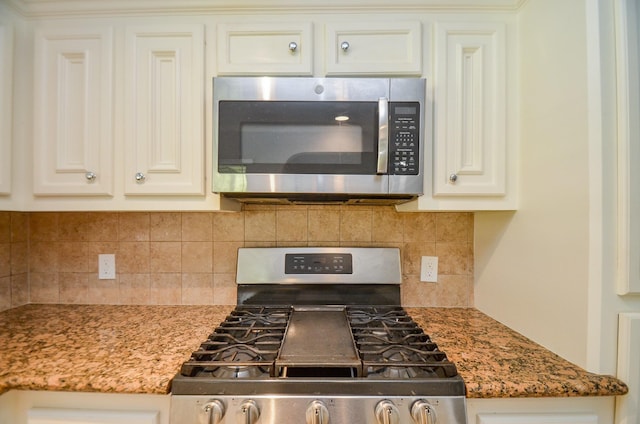 6606 Flamingo Dr, Houston, TX 77087 - kitchen featuring tasteful backsplash, appliances with stainless steel finishes, and light stone countertops
