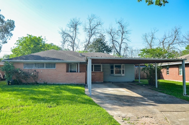 6606 Flamingo Dr, Houston, TX 77087 - ranch-style home with a carport, brick siding, driveway, and a front lawn