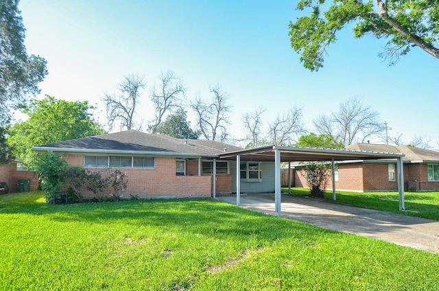 6606 Flamingo Dr, Houston, TX 77087 - ranch-style house featuring a carport, driveway, a front lawn, and brick siding