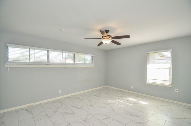 6606 Flamingo Dr, Houston, TX 77087 - unfurnished room featuring baseboards, marble finish floor, and a ceiling fan