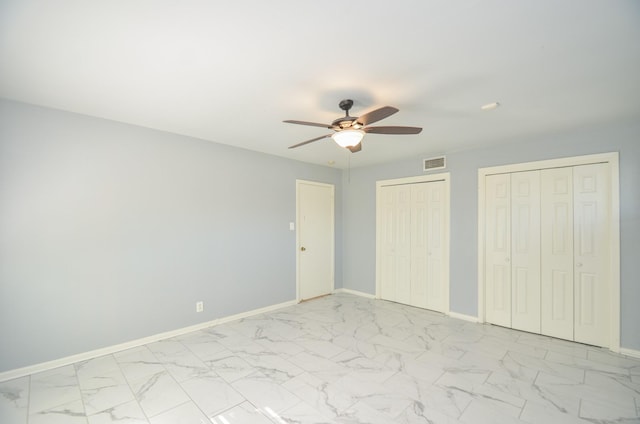 6606 Flamingo Dr, Houston, TX 77087 - unfurnished bedroom with two closets, marble finish floor, baseboards, and visible vents