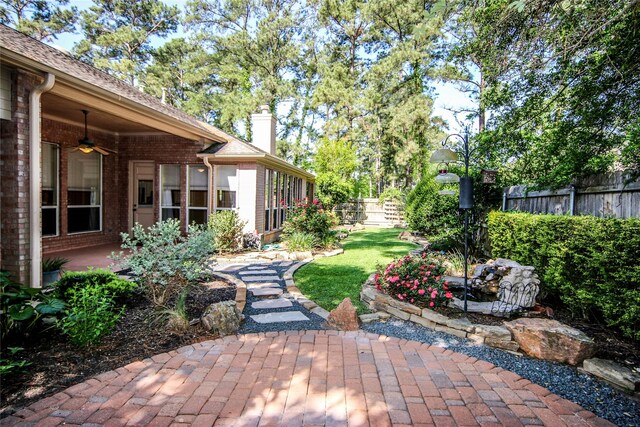 110 Wick Willow Dr, Montgomery, TX 77356 - view of yard featuring a ceiling fan and a patio area